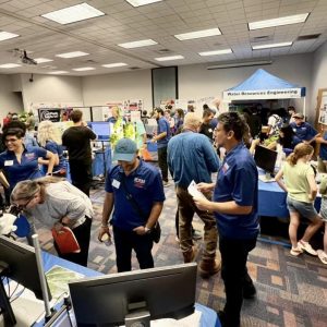 Farmers and researchers attend the 2024 SWFREC Open House.