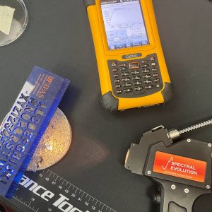 Students use spectroradiometer to analyze soil properties.